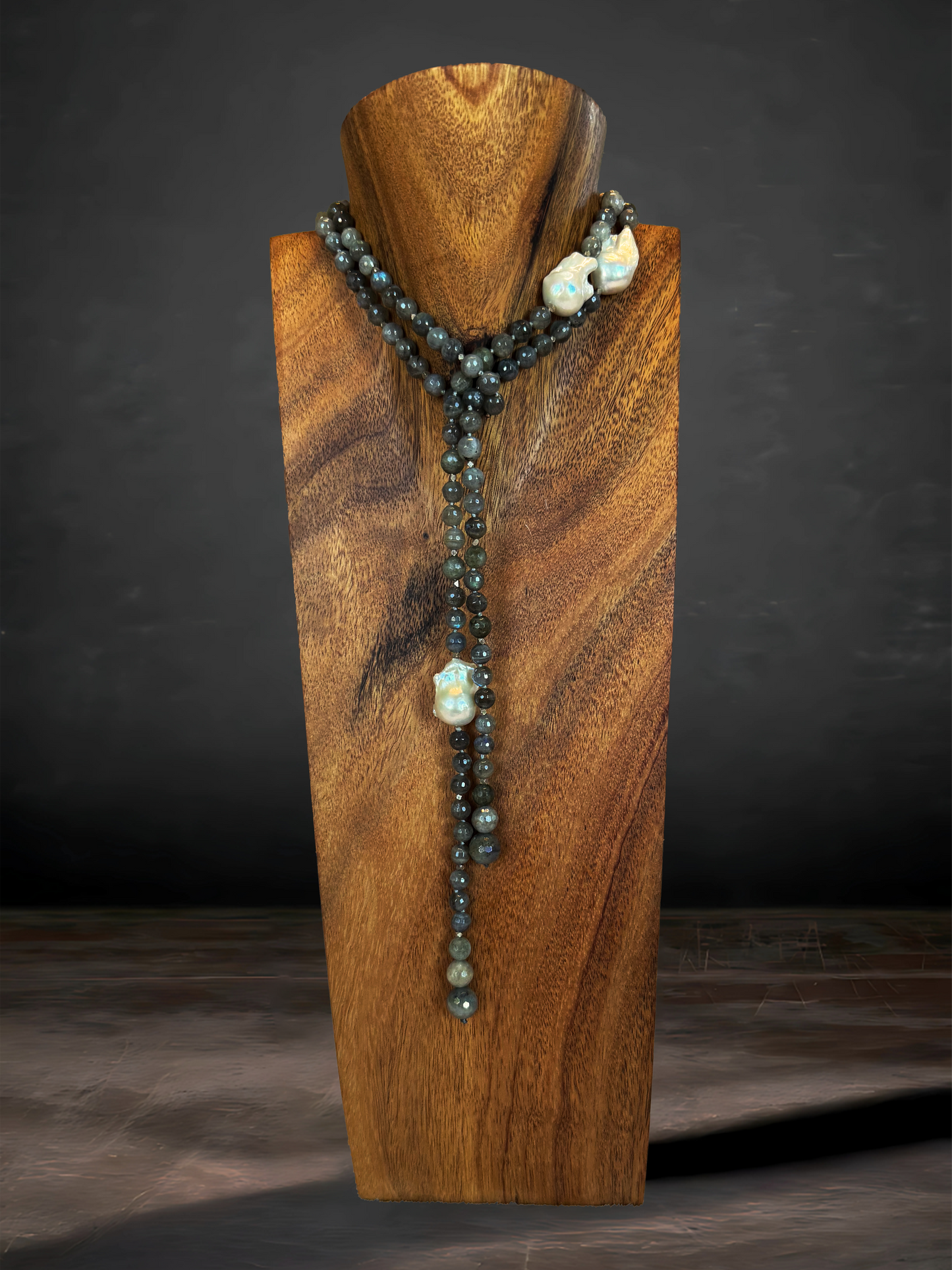 A stunning 46" Labradorite necklace, hand-knotted with three luminous Baroque freshwater pearls. Perfect for adding a touch of earthy elegance to any outfit.