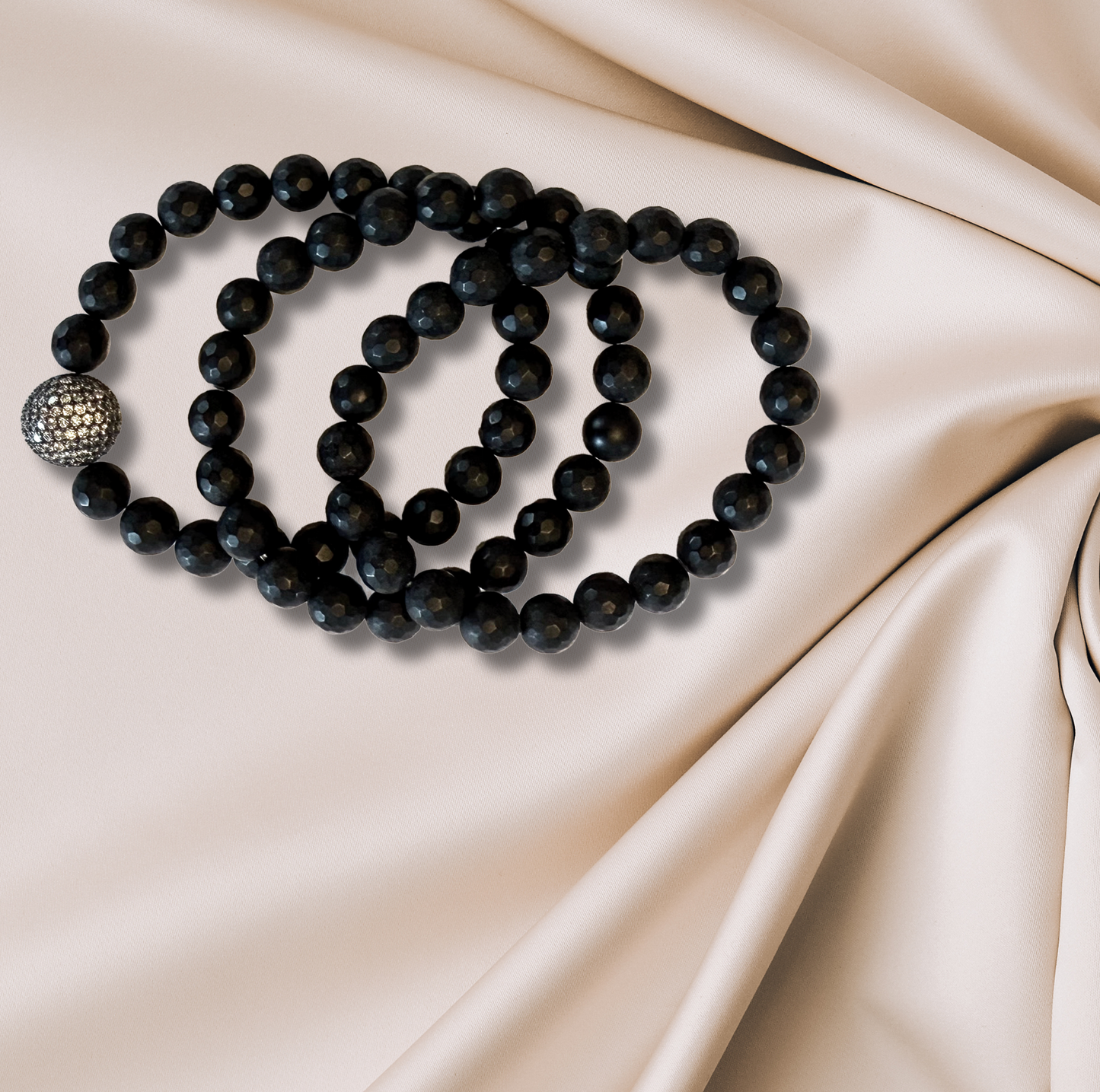 Three matte onyx bracelets with CZ accent.